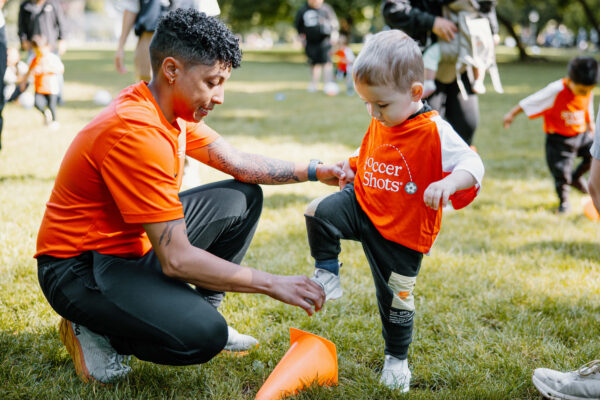 Coach working with small child