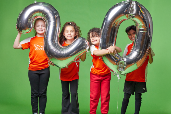 Kids holding mylar balloons